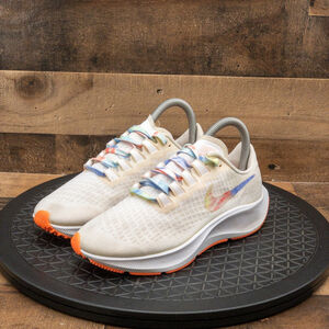 Nike Women's White Multicolor Running Shoes with Orange Accents